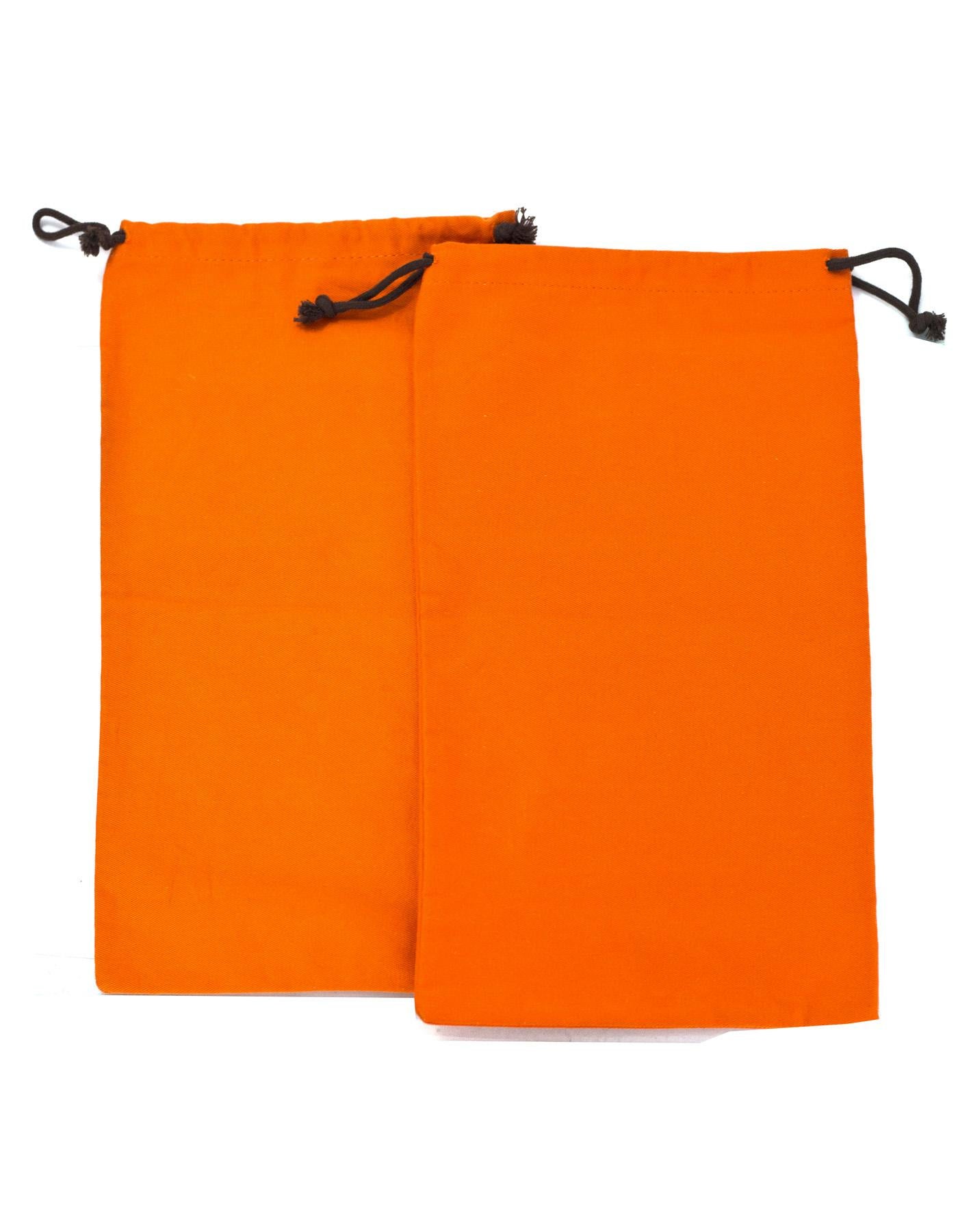 Hermes Orange Canvas Set of Two Travel Shoe Dust Bags
Features Hermes logo printed on front

Color: Orange and brown
Materials: Canvas
Closure/Opening: Drawstring closure
Overall Condition: Excellent pre-owned condition 

Measurements: 
Width: