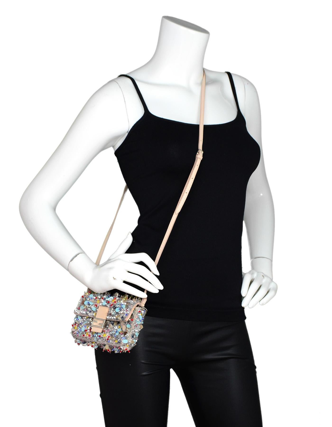 Fendi Beaded Sequin Blush Micro Baguette Crossbody Bag W/ Dust Bag

Made In: Italy
Color: Blush and multi-color
Hardware: Silvertone
Materials: Beaded, sequin, leather, and metal
Lining: Pink suede 
Closure/Opening: Flap top w/ FF logo magnetic