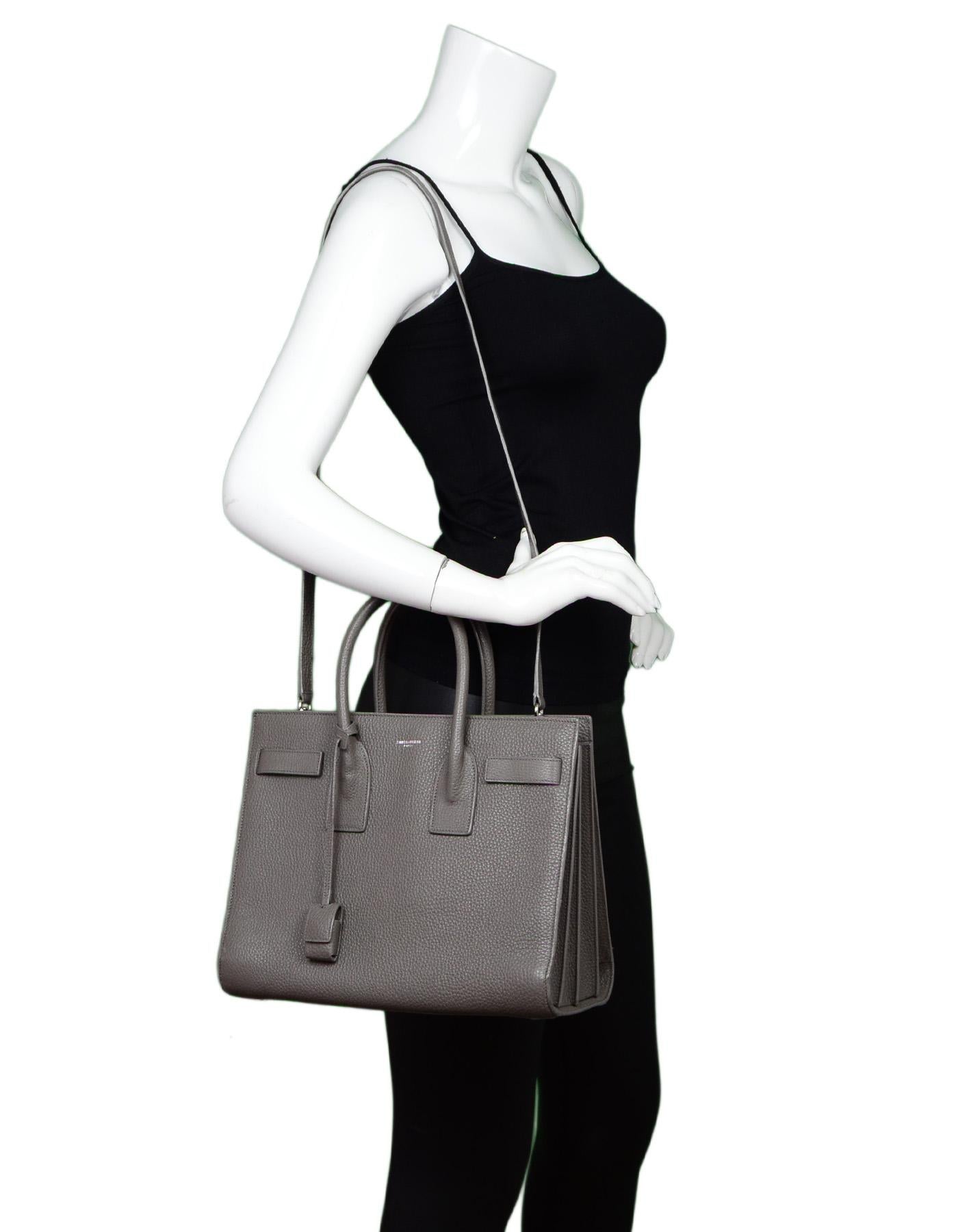 YSL Yves Saint Laurent Grey Pebbled Leather Small Sac De Jour Tote Bag W/ Dust Bag

Made In: Italy
Color: Grey
Hardware: Silvertone
Materials: Leather, metal
Lining: Black textile
Closure/Opening: Open top
Exterior Pockets: None
Interior Pockets: