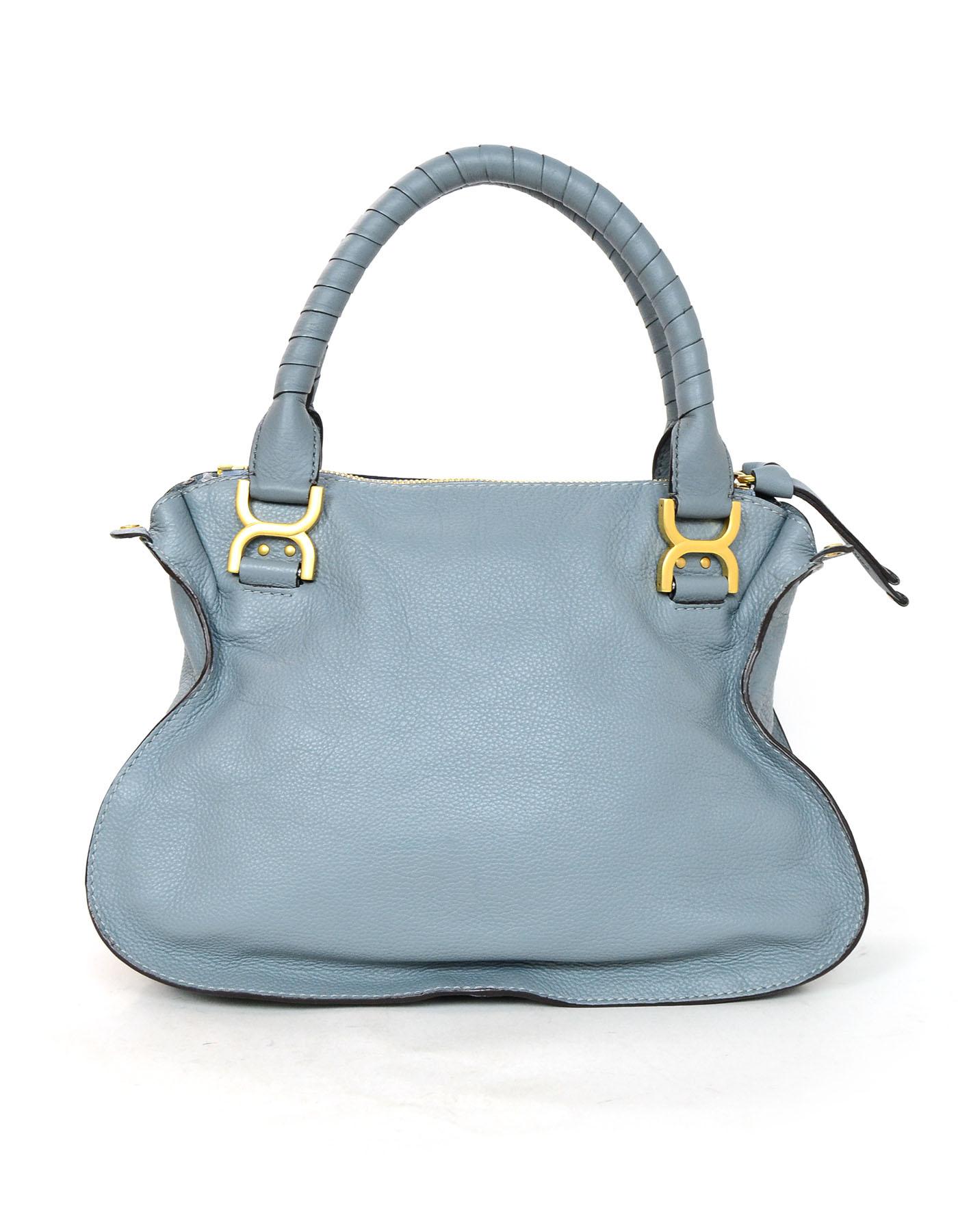 Chloe Cloudy Blue Leather Medium Marcie Satchel Bag

Made In: Italy
Color: Cloudy blue
Hardware: Goldtone
Materials: Leather, gold
Lining: Brown textile
Closure/Opening: Zip top
Exterior Pockets: Under front flap
Interior Pockets: Zip wall pocket,