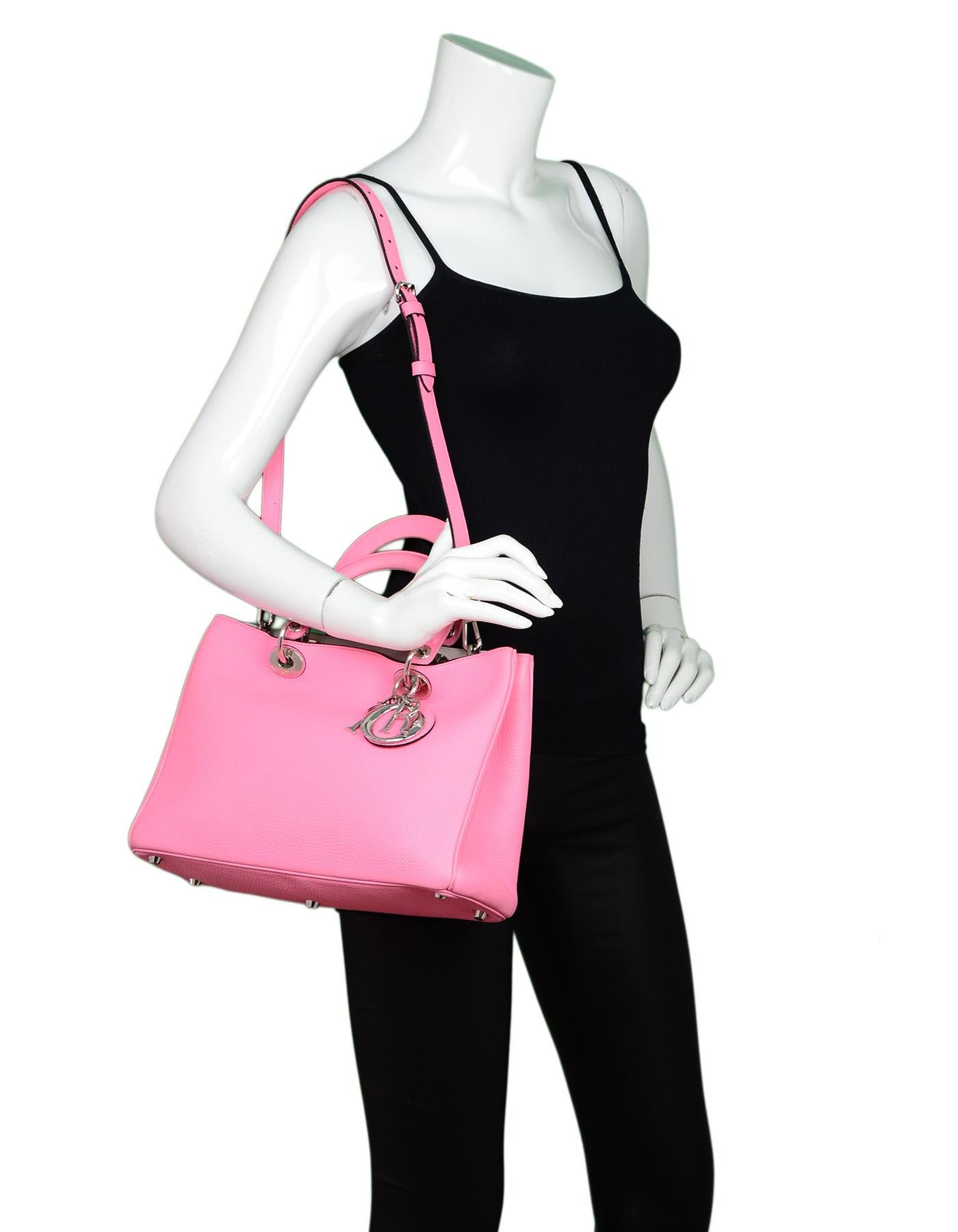 Christian Dior Pink Bullcalf Leather Medium Diorissimo Tote Bag W/ Dust Bag/Pouch 

Made In: Italy
Color: Pink
Hardware: Silvertone
Materials: Bullcalf textured leather
Lining: Light grey leather 
Closure/Opening: Magnetic tab closure in center