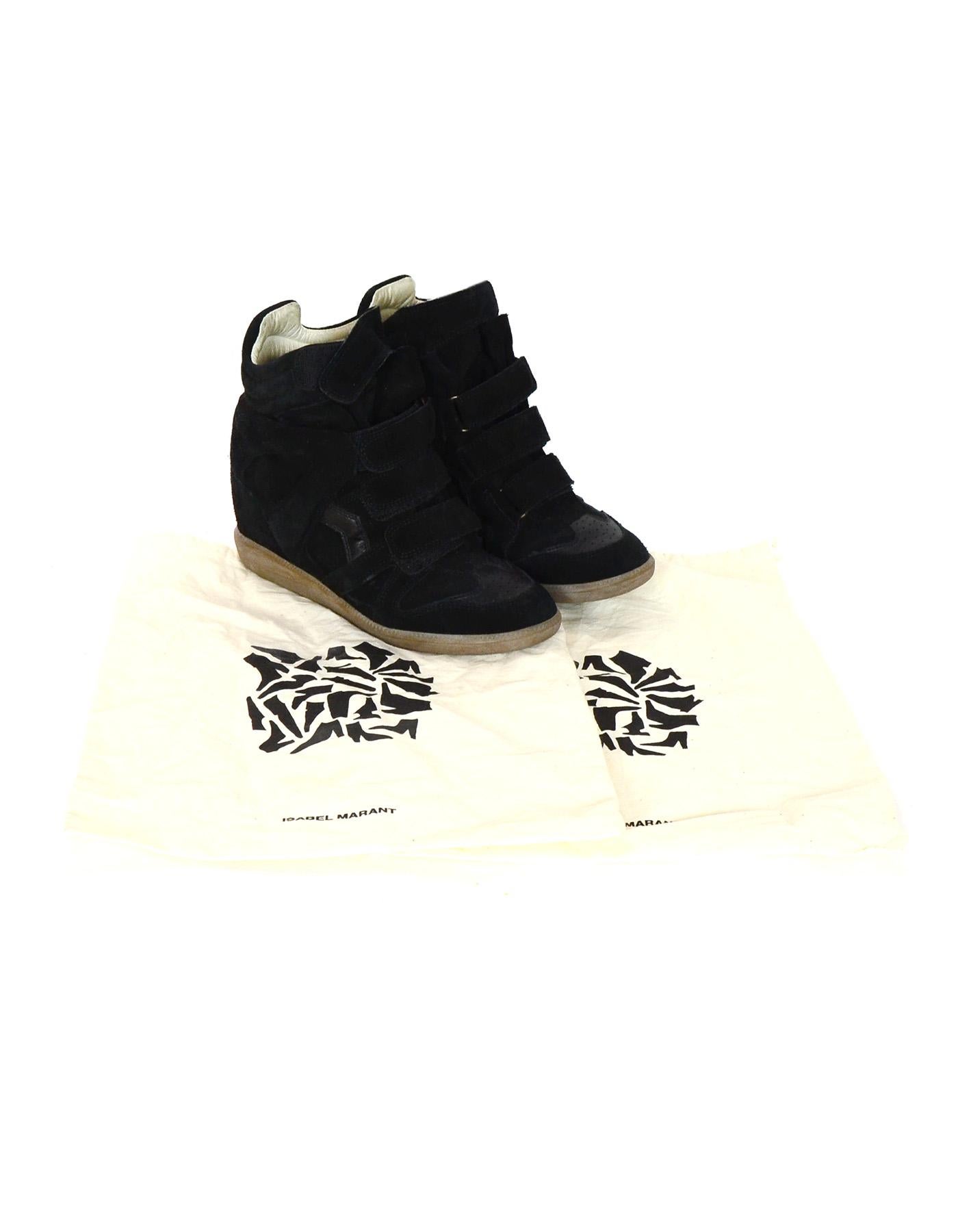 Isabel Marant Black Suede Beckett Wedge Sneakers Sz 38

Color: Black
Materials: Leather, suede
Closure/Opening: Velcro closure
Overall Condition: Excellent pre-owned condition with the exception of minor wear in suede
Retail Price: $600+