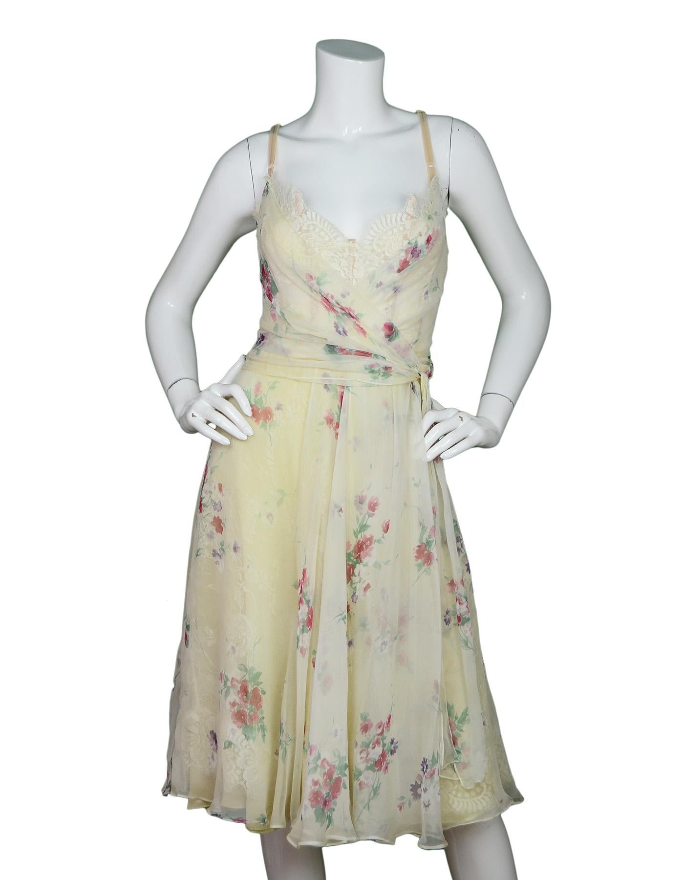 Dolce & Gabbana White Silk Floral Spaghetti Strap Dress W/ Boned Bust Lace Sz 42

Made In: Italy
Color: Ivory/white, pink & green flowers
Materials: 48% silk, 35% rayon, 10% polyester, 4% tactel, 3% nylon
Lining: 100% silk
Opening/Closure: Hidden