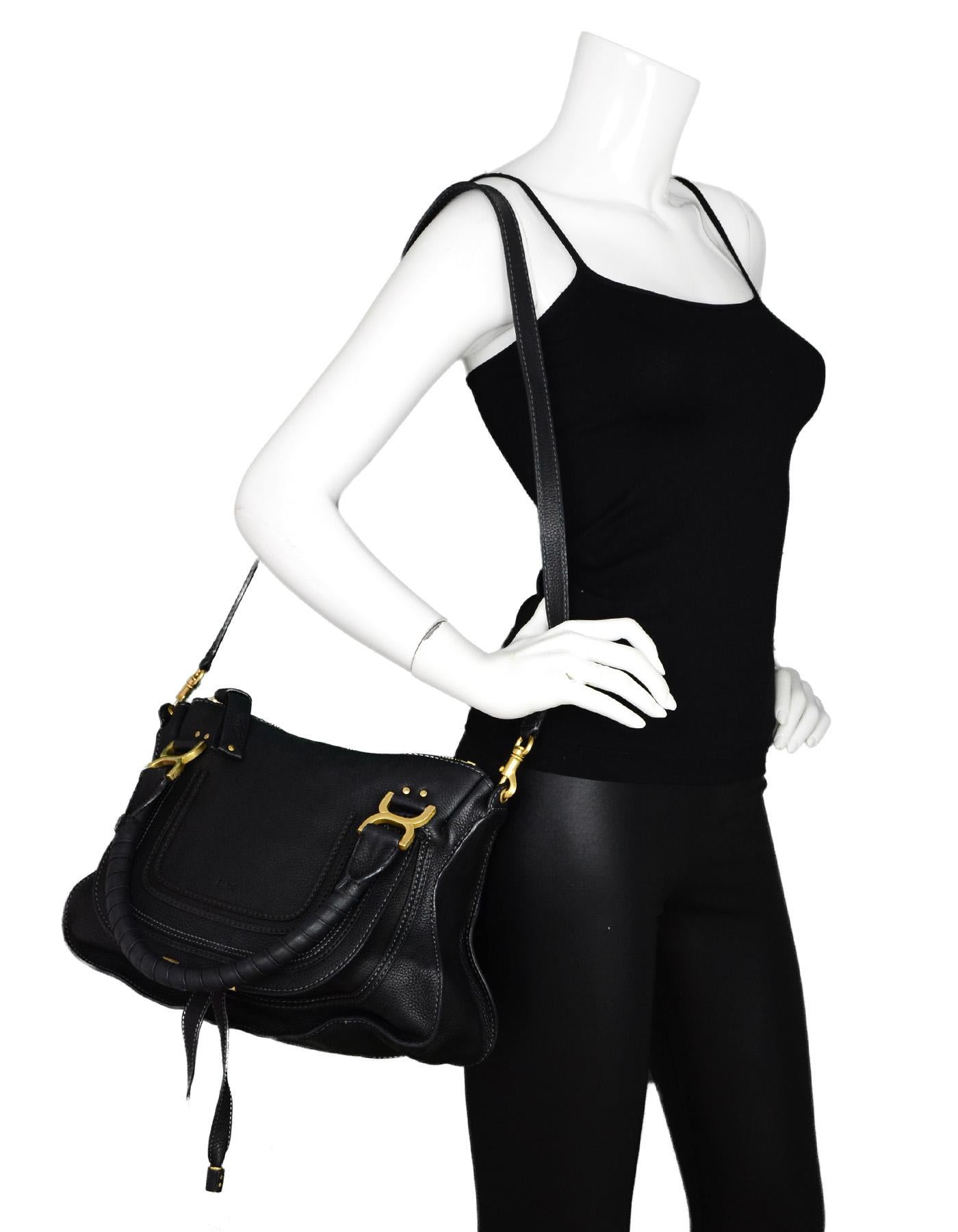 Chloe Black Leather Medium Marcie Satchel Bag W/ Crossbody Strap

Made In: Italy
Color: Black
Hardware: Goldtone
Materials: Leather, goldtone metal 
Lining: Taupe textile
Closure/Opening: Zip top
Exterior Pockets: One open pocket under front flap