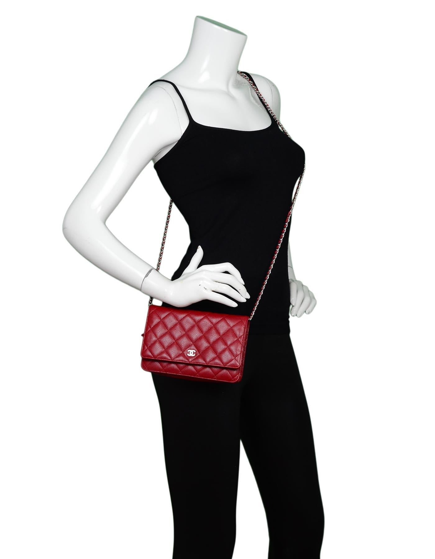 Chanel Red Caviar Leather WOC Wallet On Chain Crossbody Bag

Made In: France
Year Of Production: 2010 - 2011
Color: Red
Hardware: Silvertone
Materials: Caviar leather and metal
Lining: Red grosgrain
Closure/Opening: Flap top with snap