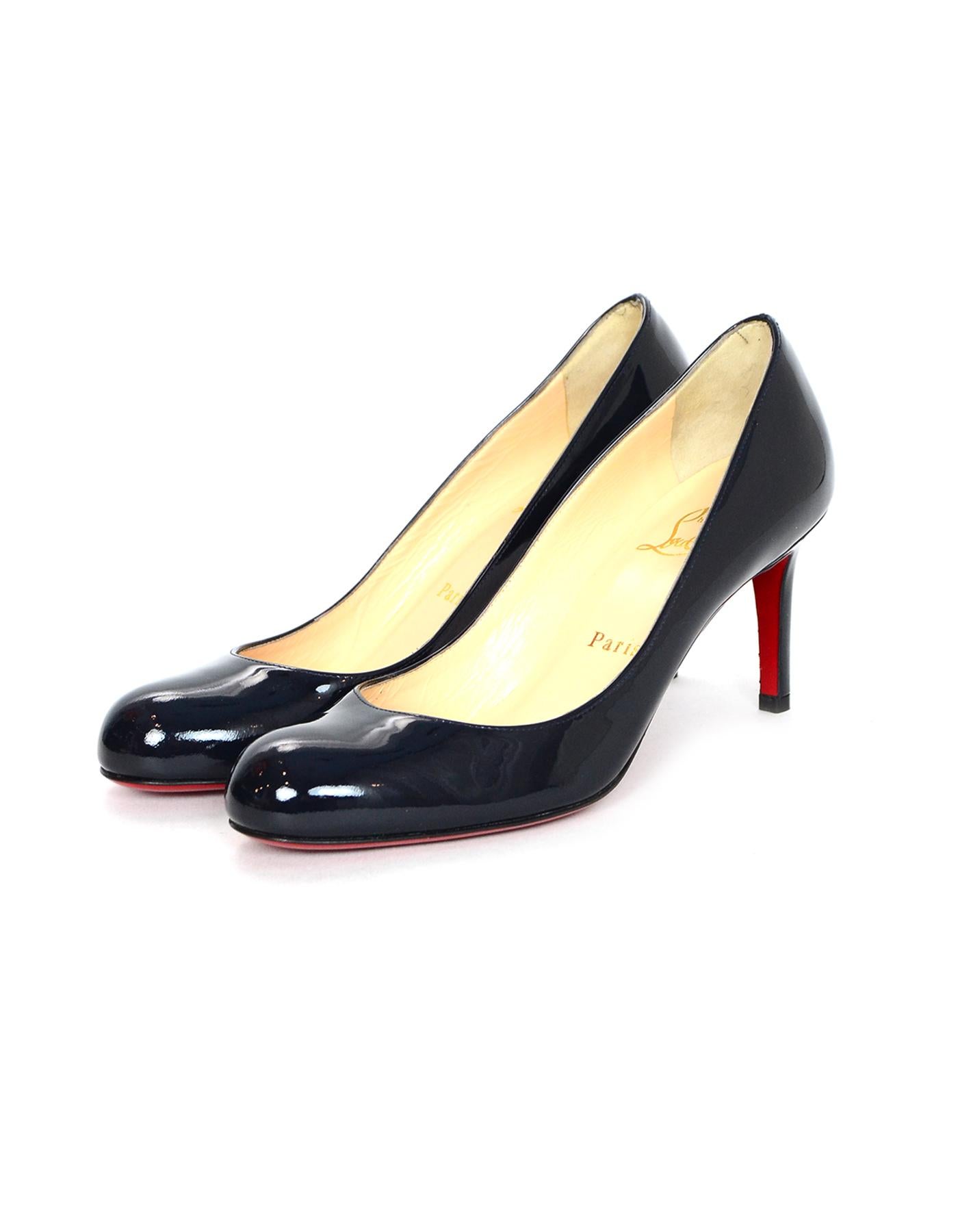 Christian Louboutin Navy Patent Leather Simple 80mm Pumps Sz 37

Made In: Italy
Color: Navy
Materials: Patent leather 
Closure/Opening: Slide on 
Overall Condition: Excellent pre-owned condition 
Estimated Retail: $695 + tax

Measurements: 
Marked