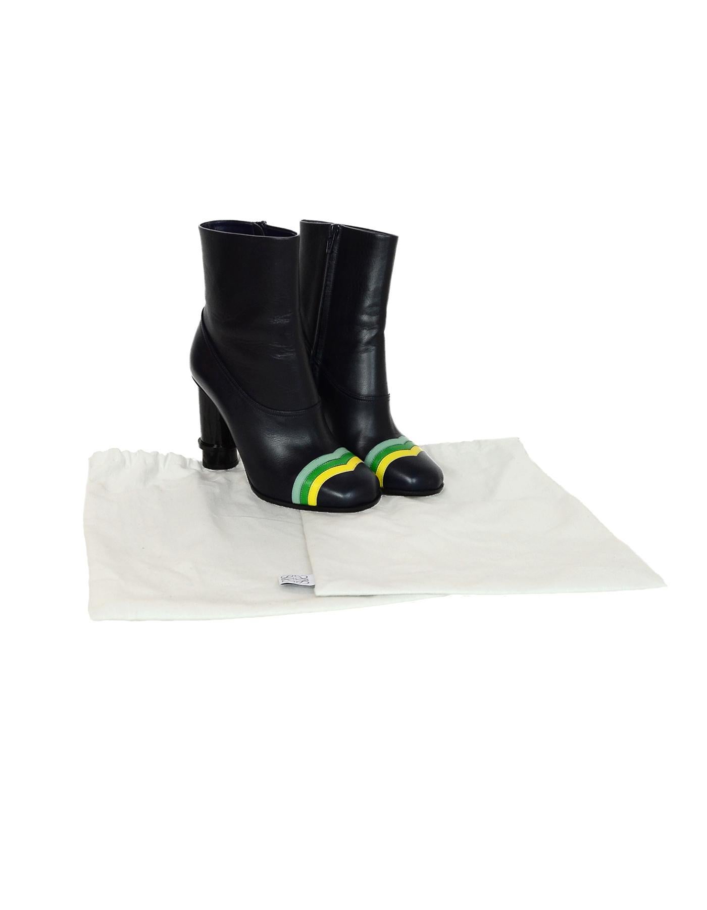 Loewe Navy Heeled Boot W/ Green/Yellow Chevron Striped Toe Design Sz 37

Made In: Italy
Color: Navy, light and dark green, yellow
Hardware: Black
Materials: Leather
Closure/Opening: Full side zipper
Overall Condition: Excellent, like new condition