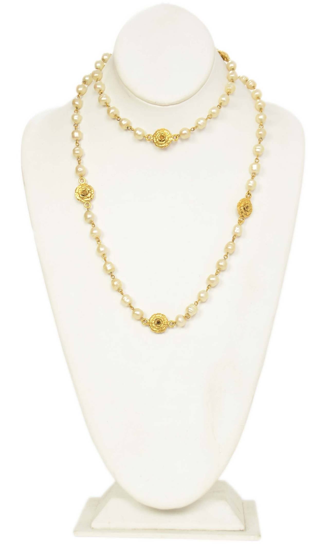 Chanel Vintage '82 Pearl Necklace w/Gold Rose PendantsFeatures CC engraved on clasp

    Made in: France
    Year of Production: 1982
    Stamp: CHANEL CC 1982
    Closure: Push and click clasp
    Color: Ivory and goldtone
    Materials: