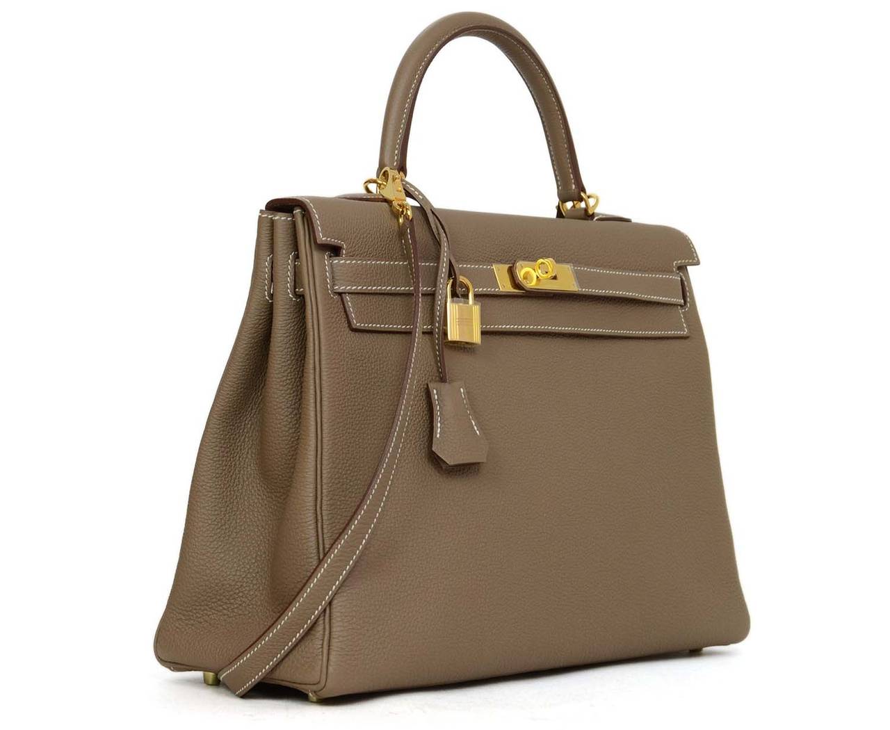 Hermes '13 Taupe Togo Leather 35 cm Kelly BagFeatures Souple Togo Leather for a softer appearance to the bag

    Made in: France
    Year of Production: 2013
    Color: Taupe
    Hardware: Gold plated
    Materials: Togo leather
    Lining: