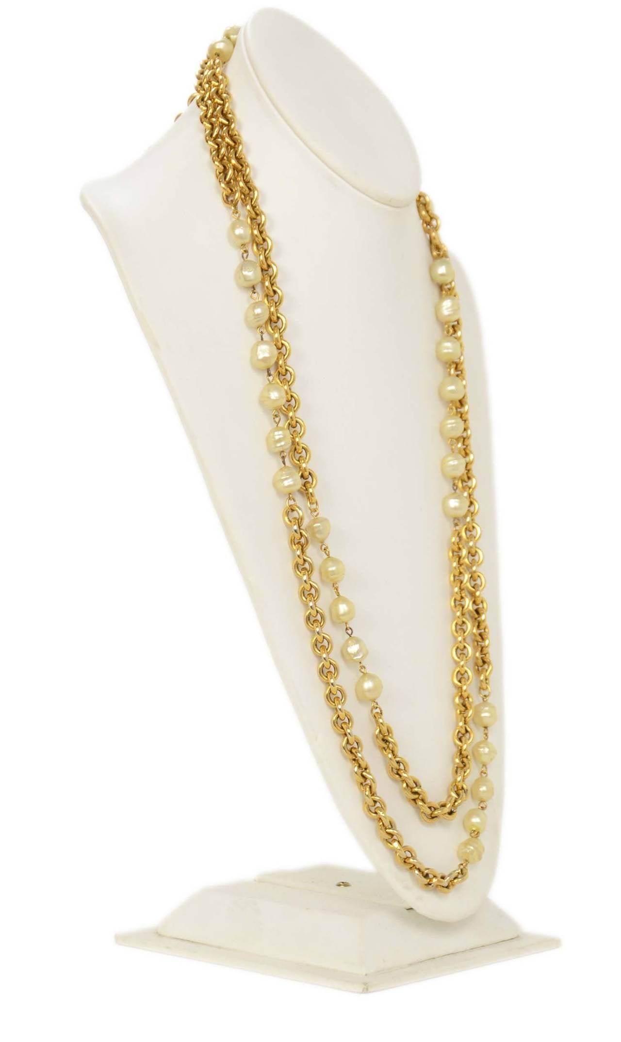 Chanel Vintage '84 Gold & Pearl Double Strand Necklace

    Made in: France
    Year of Production: 1984
    Stamp: CHANEL CC 1984
    Closure: Jump ring closure
    Color: Gold and ivory
    Materials: Metal and faux pearls
    Overall