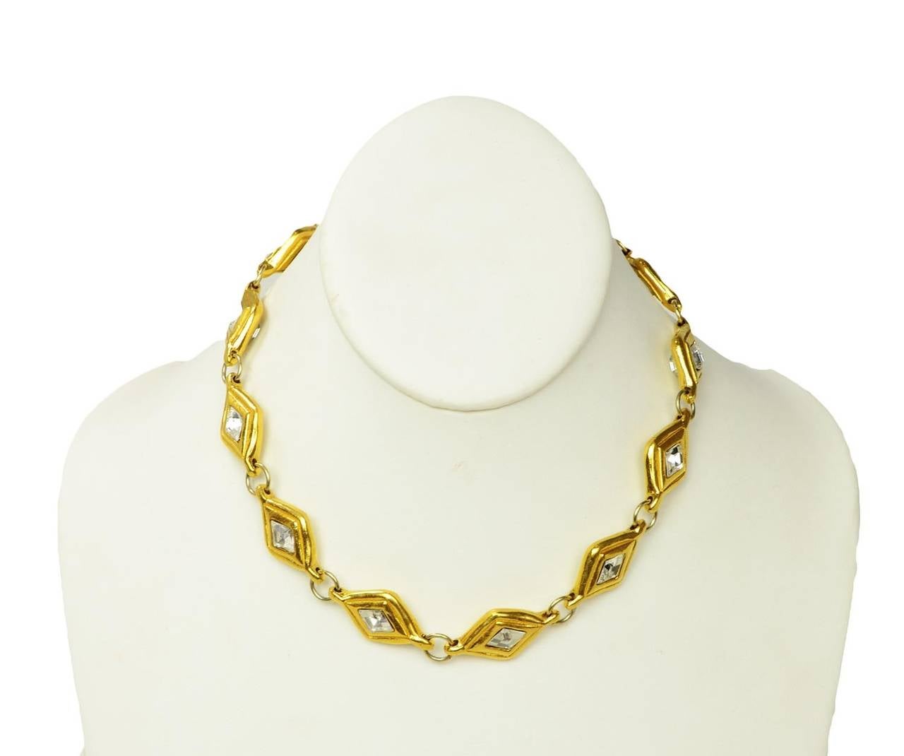 Chanel Vintage '70s Gold Choker Necklace w/Diamond Shaped Crystal Links

    Made in: France
    Year of Production: 1970's
    Stamp: CHANEL CC MADE IN FRANCE
    Closure: Jump ring closure
    Color: Goldtone
    Materials: Metal and crystal
   