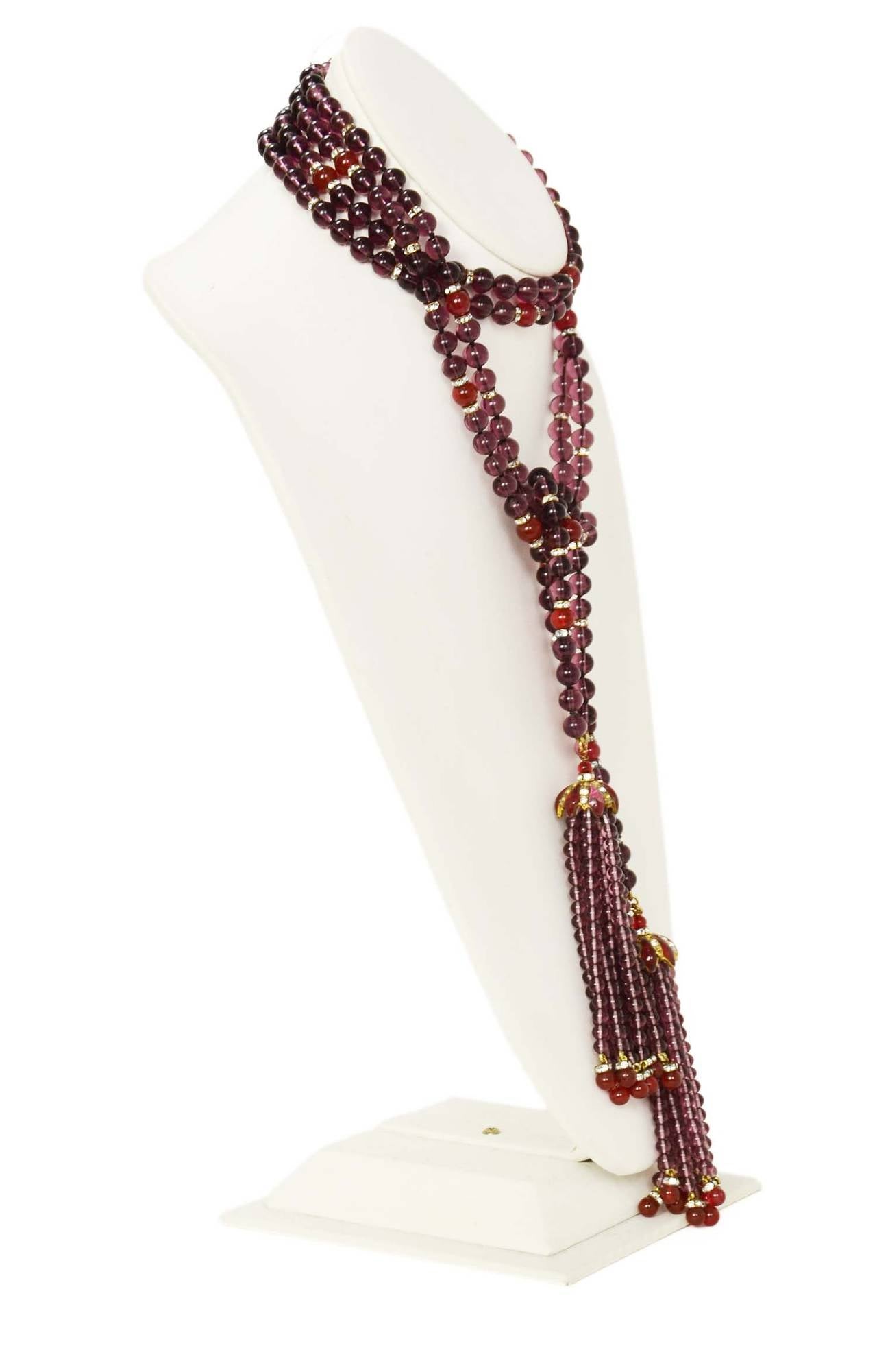 Chanel Vintage '83 Double  Gripoix Lariat Necklace w/ TasselsFeatures purple and red gripoix beads with strass crystal spacers. Tassels at each end of necklace. Can be worn tied long or wrap around neck and then tied.

    Made in: France
   