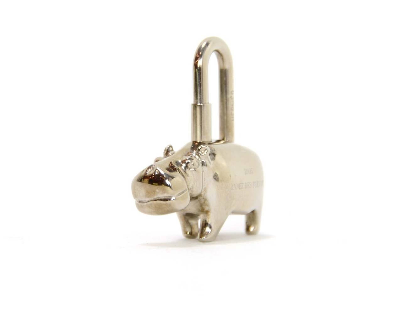 Hermes 2005 Silver Hippo Key Ring

    Made in: France
    Year of Production: 2005
    Stamp: 2005 Anne Des Fleuves
    Closure: Screw on
    Color: Silver
    Materials: Silver
    Overall Condition: Excellent with no signs of wear or