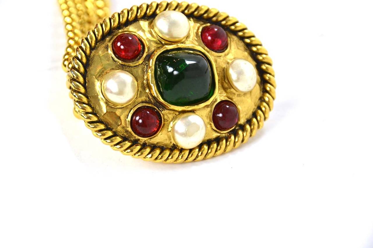 Chanel Vintage '50s-'60s Pearl & Gripoix Gold Chain Belt
Features oval belt buckle with faux pearl and red and green gripoix detailing

Made in: France
Year of Production: 1950's-1960's
Color: Gold, ivory, red and green
Stamp: CHANEL