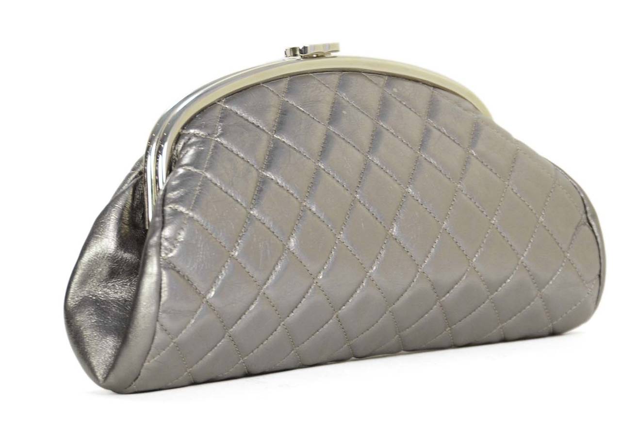 Features classic quilting with frame top

-Made in: Italy
-Year of Production: 2008-2009
-Color: Silver
-Hardware: Silvertone
-Materials: Leather and metal
-Lining: Silver leather
-Closure/opening: Top center CC clasp
-Exterior Pockets: