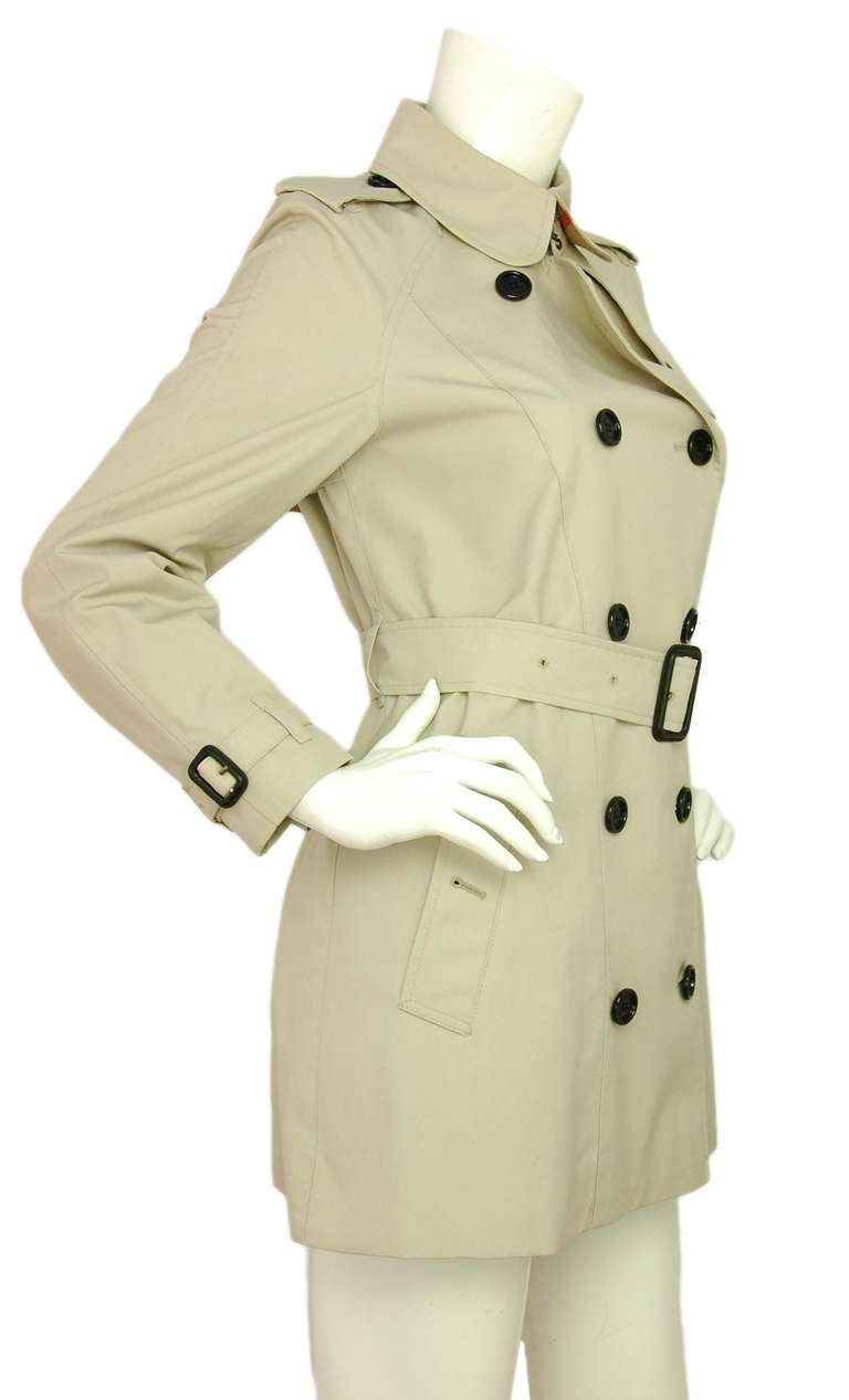 Burberry Beige Double Breasted Trench Coat W/Belt-Sz 6 (Rt. $1,700)

    Made in Italy
    Composition: 65% polyester, 35% cotton
    Classic style trench has two front pockets and nova plaid lining
    Black Burberry buttons
    Labeled