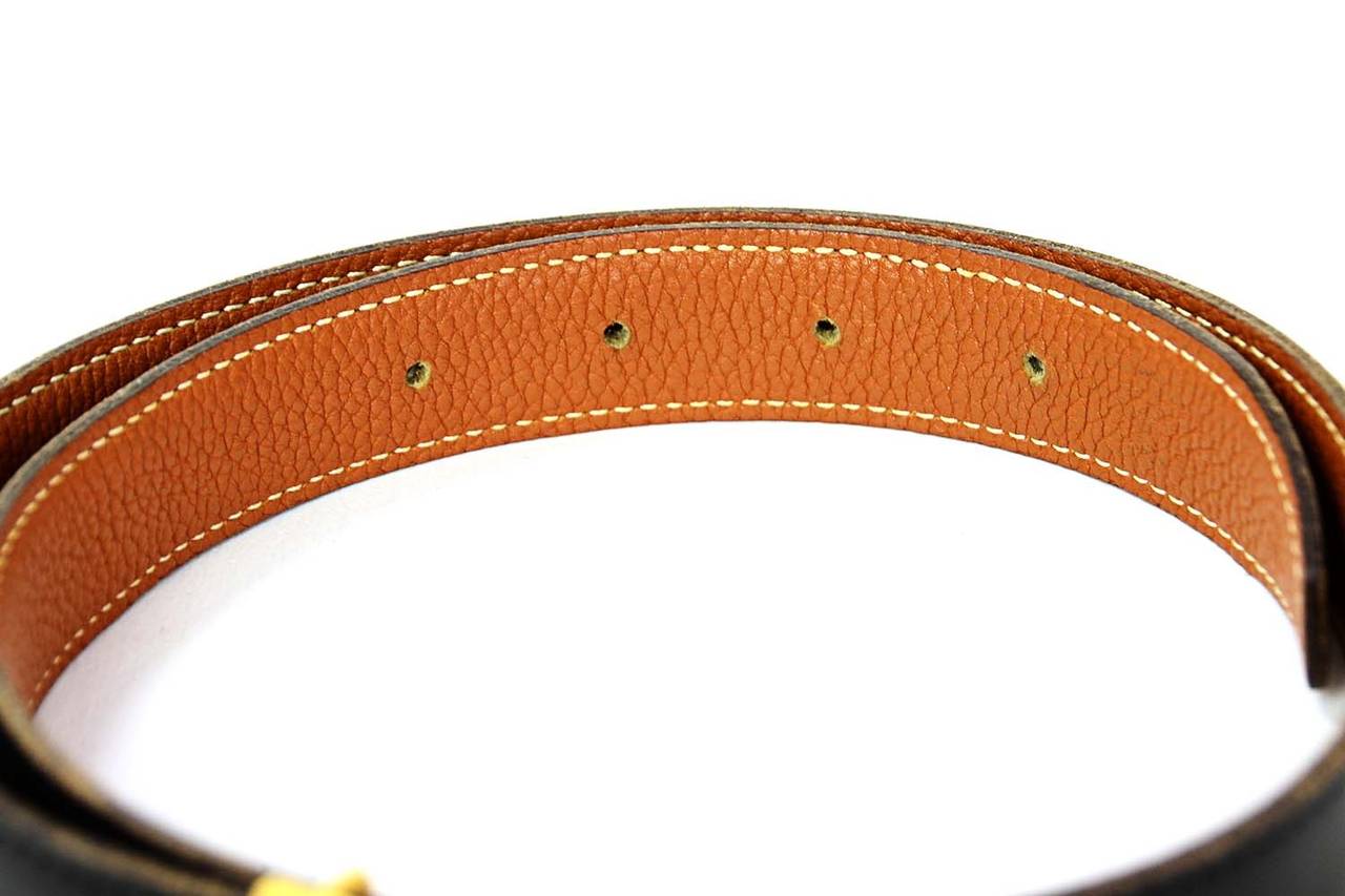 HERMES Narrow Black Box and Tan Togo Leather Belt w/ Gold H Buckle c.2003Belt is reversible between Black and TanMade in: FranceYear of Production: 2003Color: Black and TanHardware: GoldtoneMaterials: Black box leather and tan togo leatherSerial