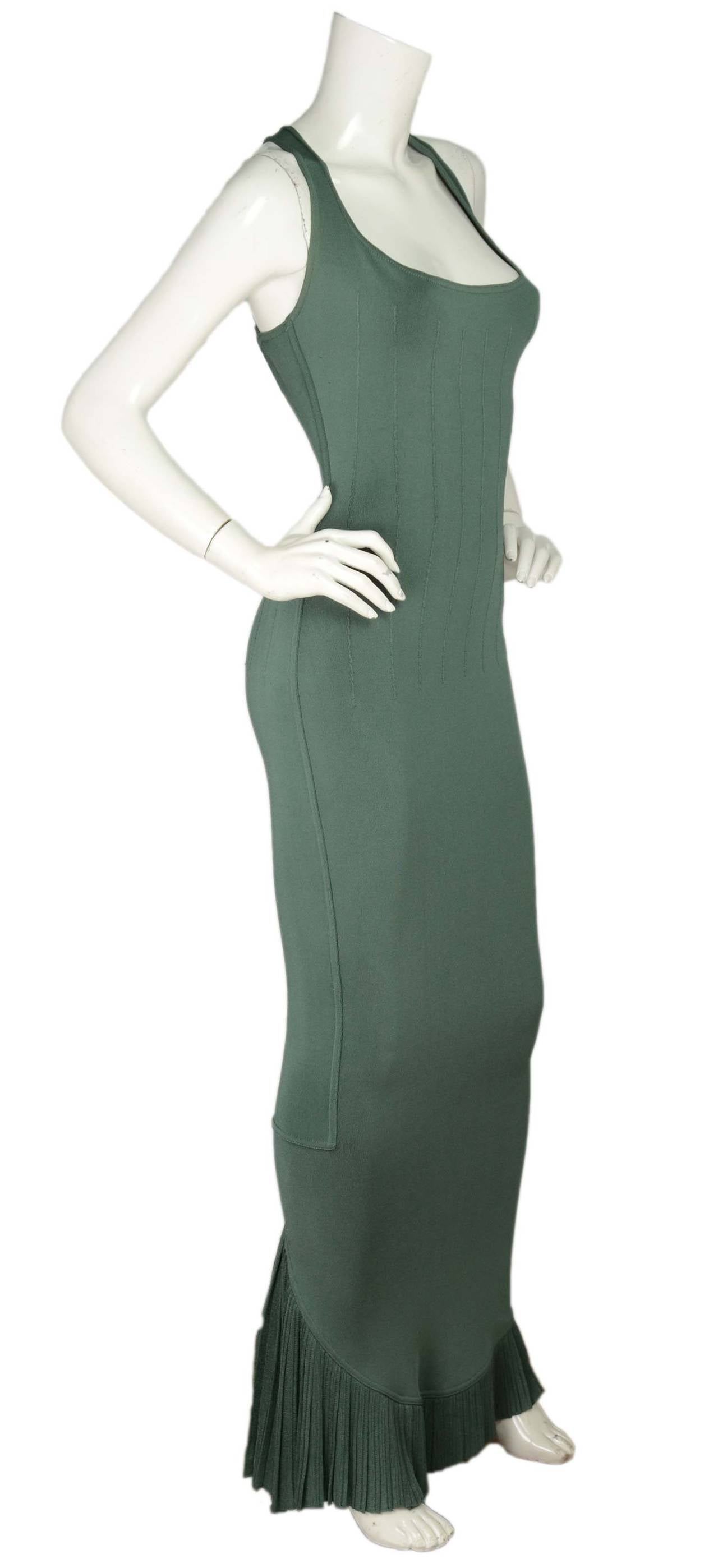 Alaia Green Sleeveless Gown w/Ruffle Detailing at HemlineFeatures vertical stitching detailing through bust and waist

    Made in: Italy
    Color: Green
    Composition:  85% rayon, 15% spandex
    Lining: None
    Closure/opening: Pull