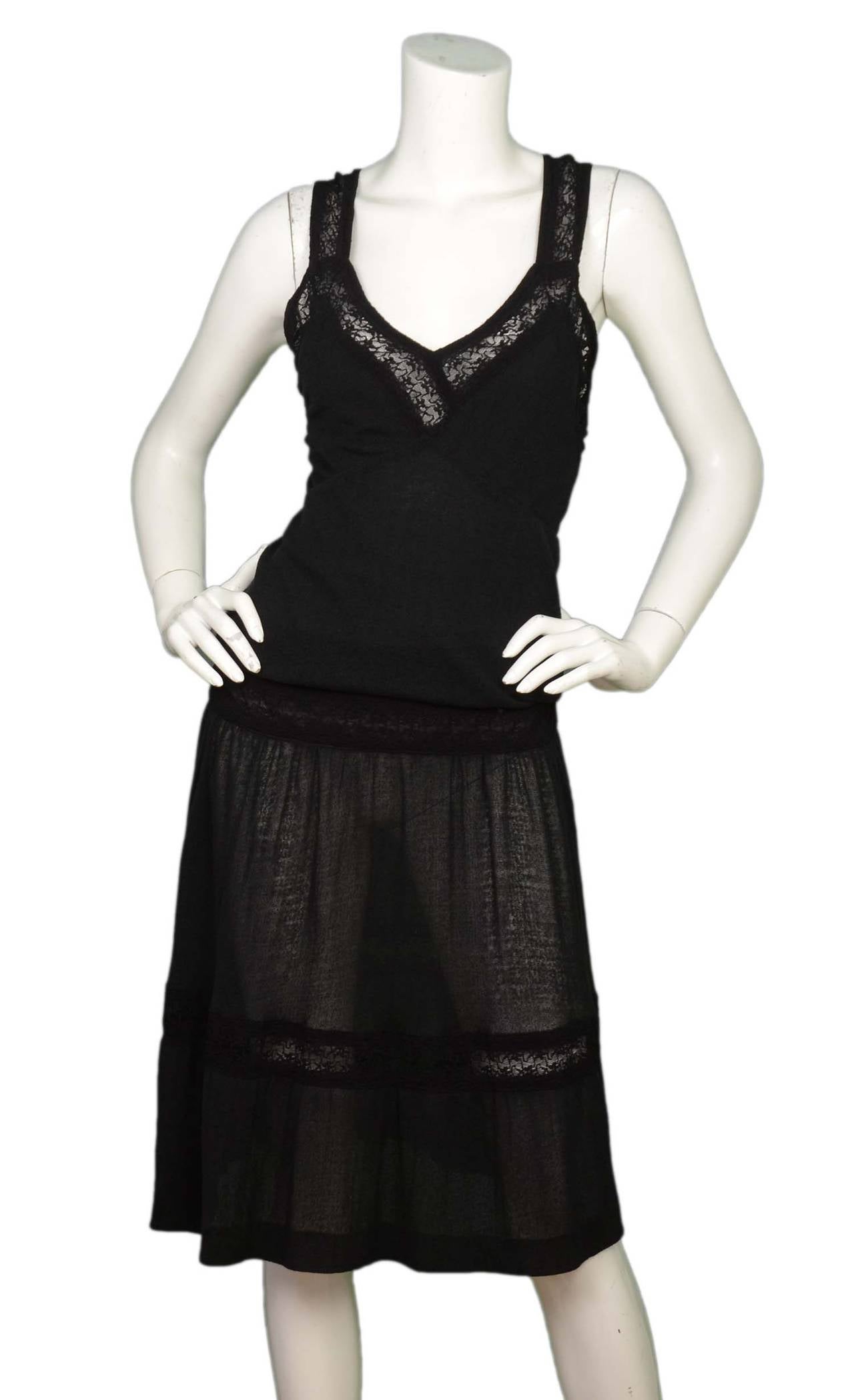 Chanel '05 Black Lace Crochet Dress w/Crisscross Back
Features versatile straps w/button closures to create crisscross or normal straps

    Made in: France
    Year of Production: 2005
    Color: Black
    Composition: 74% cotton, 26% nylon
