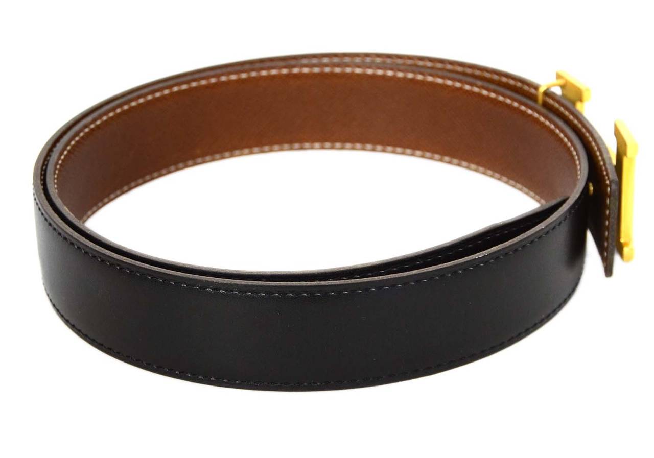 Hermes '01 Reversible Brown/Black Leather Belt w/Gold H Buckle 
Made in: France
Year of Production: 2001
Color: Black, brown and gold
Hardware: Goldtone
Materials: Leather and metal
Serial Number/Date Stamp: E stamp in square
Opening/Closure: