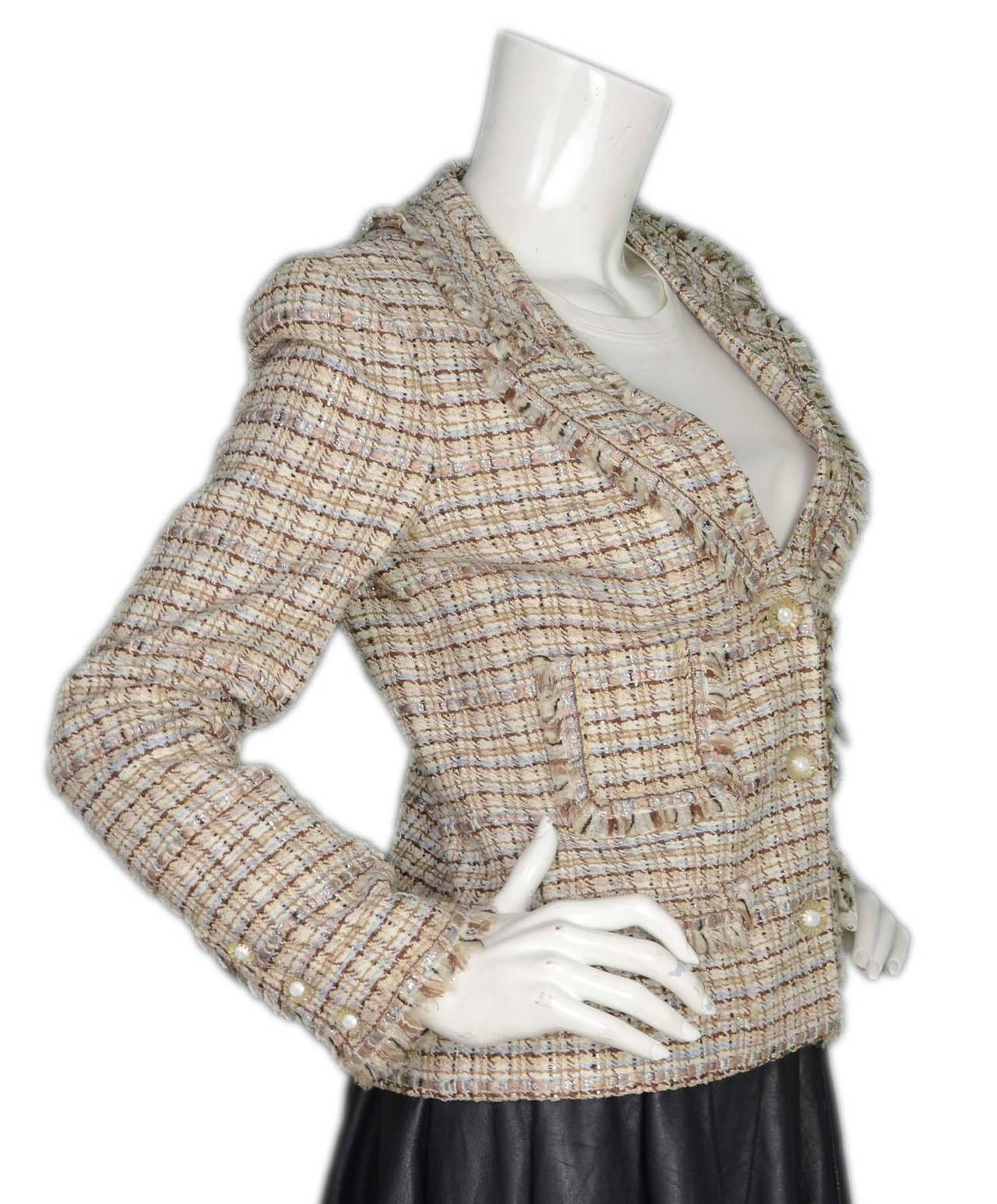 Chanel '04 Beige/Brown/Light Blue Tweed Single Breasted BlazerFeatures white resin CC buttons

    Made in: France
    Year of Production: 2004
    Color: Beige, tan, brown, light blue and white
    Composition:  30% silk, 30% wool, 20% rayon,