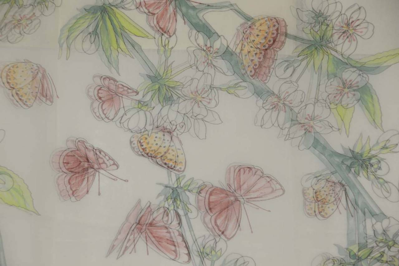 Hermes Pale Pink Floral & Butterfly Silk Scarf
Features large butterfly and floral prints throughout

    Made in: France
    Color: Pale pink and green
    Composition: 100% silk
    Overall Condition: Excellent with no visible signs of