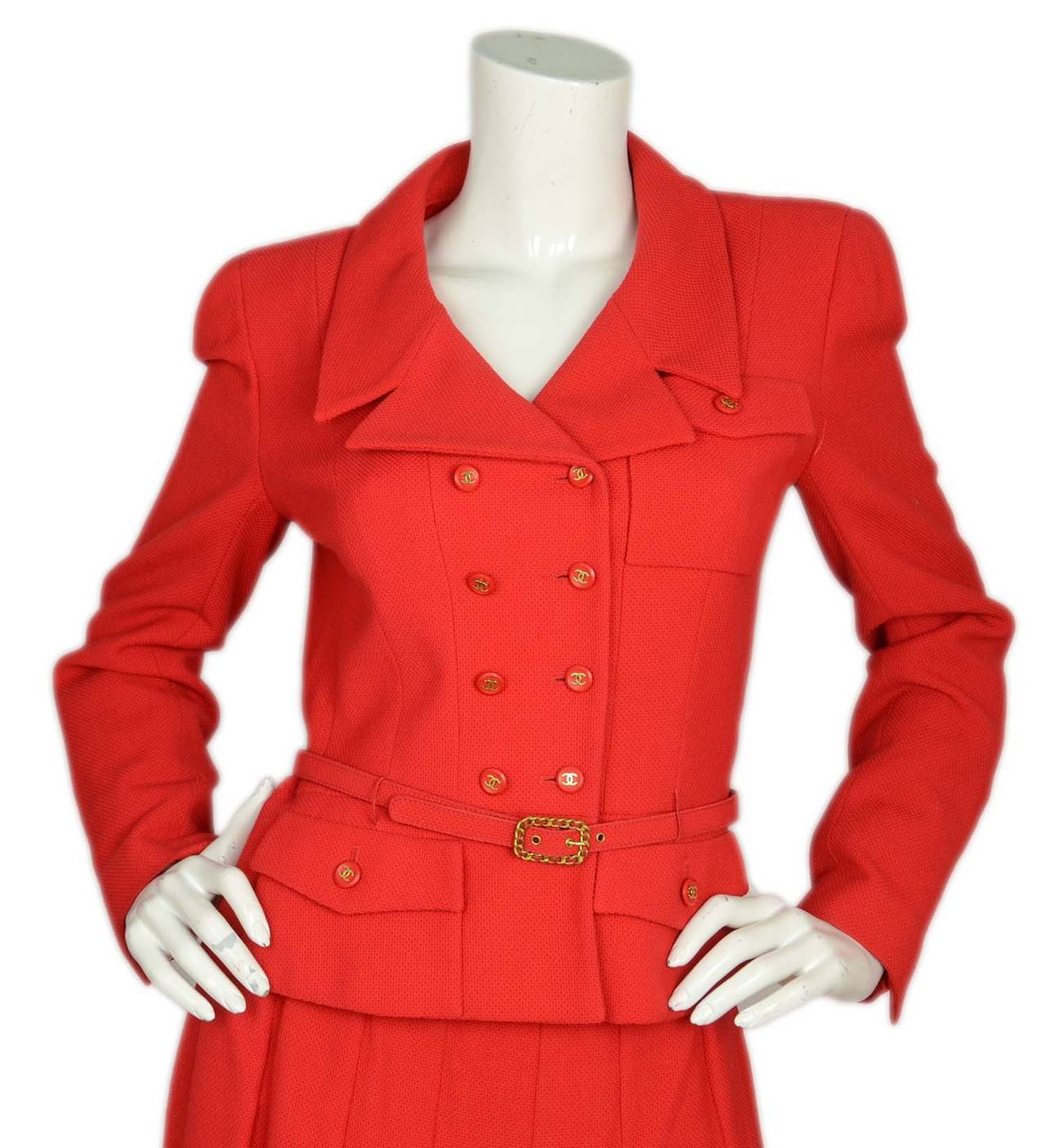 Chanel Vintage '95 Red Boucle Pleated Skirt/Double Breasted Jacket w/Belt Belt features braided goldtone hardware and jacket features peplum detailing at hem

    Made in: France
    Year of Production: 1995
    Color: Red
    Composition: