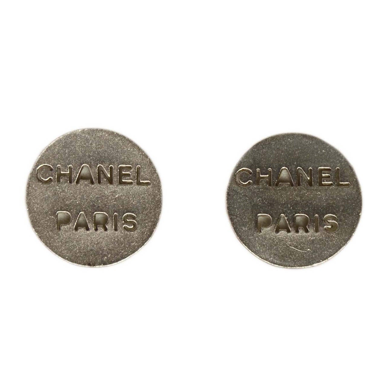 CHANEL Silver "Chanel Paris" Disc Clip On Earrings
