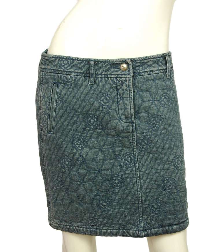 Chanel Denim Skirt With Camelia Flower Print 

    Made in Italy
    Composition: 100% cotton
    Two side pockets
    Two back pockets
    Front zipper closure with top silvertone CC button
    Five belt loops
    Labeled 