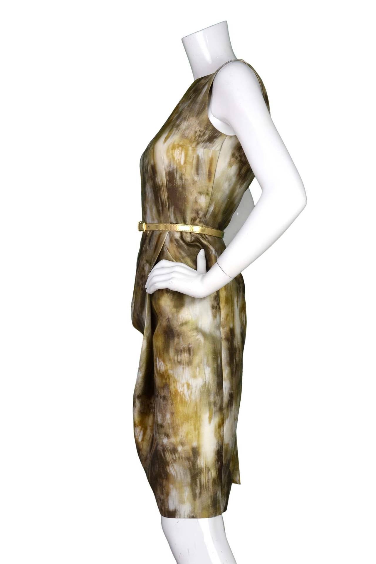 Michael Kors Brown/Olive Green/Beige Silk Brush Strokes Print DressFeatures adjustable matching belt

    Made in: Italy
    Color: Brown, olive green, beige, and yellow
    Composition: 50% wool, 50% silk
    Lining: Off-white fine textile
  