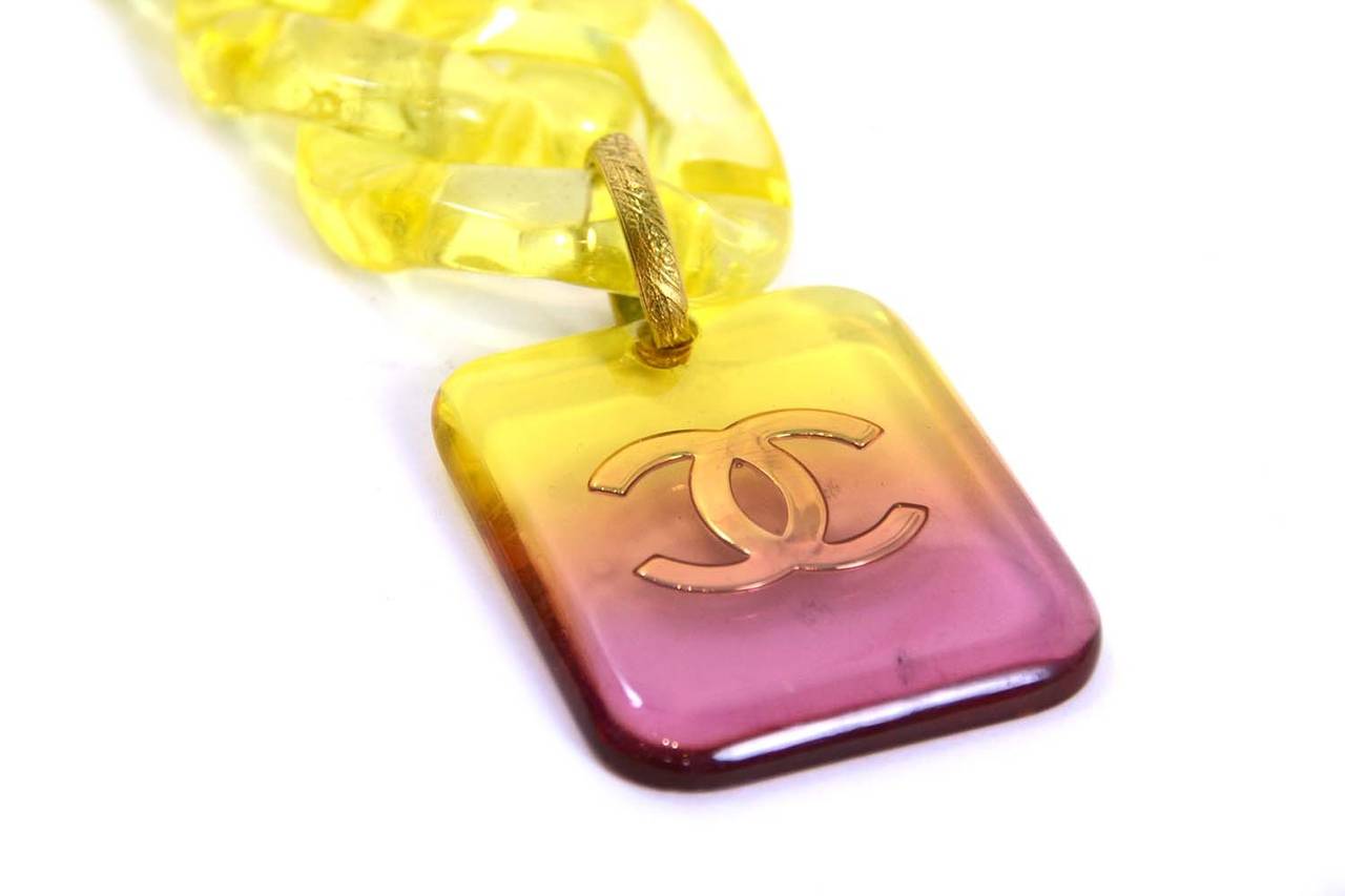 Chanel Vintage '95 Yellow to Pink Gradient Resin Chain Link Belt
Features square pendant with goldtone CC inside

    Made in: France
    Year of Production: 1995
    Stamp: 95 CC C
    Closure: hook
    Color: Red, orange, pink, yellow and gold
   