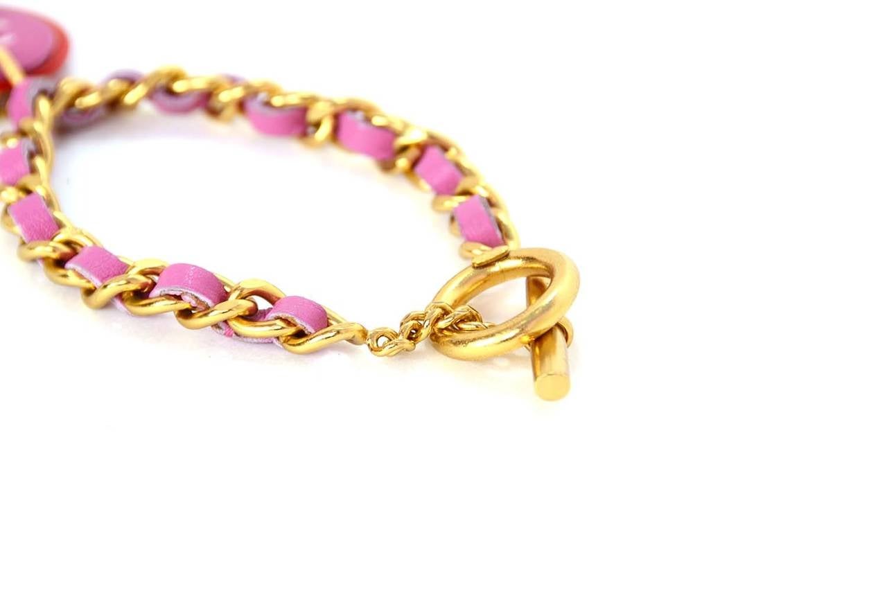 CHANEL 2001 Pink/Yellow Gold Chain Link Bracelet

    Made in: France
    Year of Production: 2001
    Stamp: CHANEL 01 A MADE IN FRANCE
    Closure: Toggle closure
    Color: Gold, pink, and red
    Materials: Metal and leather
    Overall