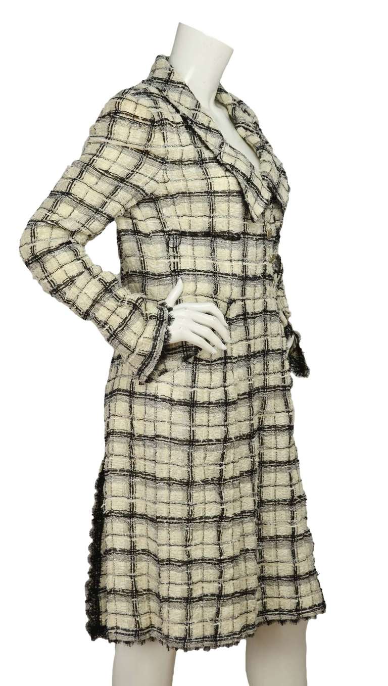 Chanel Black/White Tweed Coat W/Side Closure - Sz 42 (Rt. $5,000)

    Age: c. 2005
    Made in France
    Compositiion: 35% nylon, 32% silk, 18% rayon, 12% cotton, 2% acrylic, 1% polyester
    Four front pockets
    Three silvertone CC