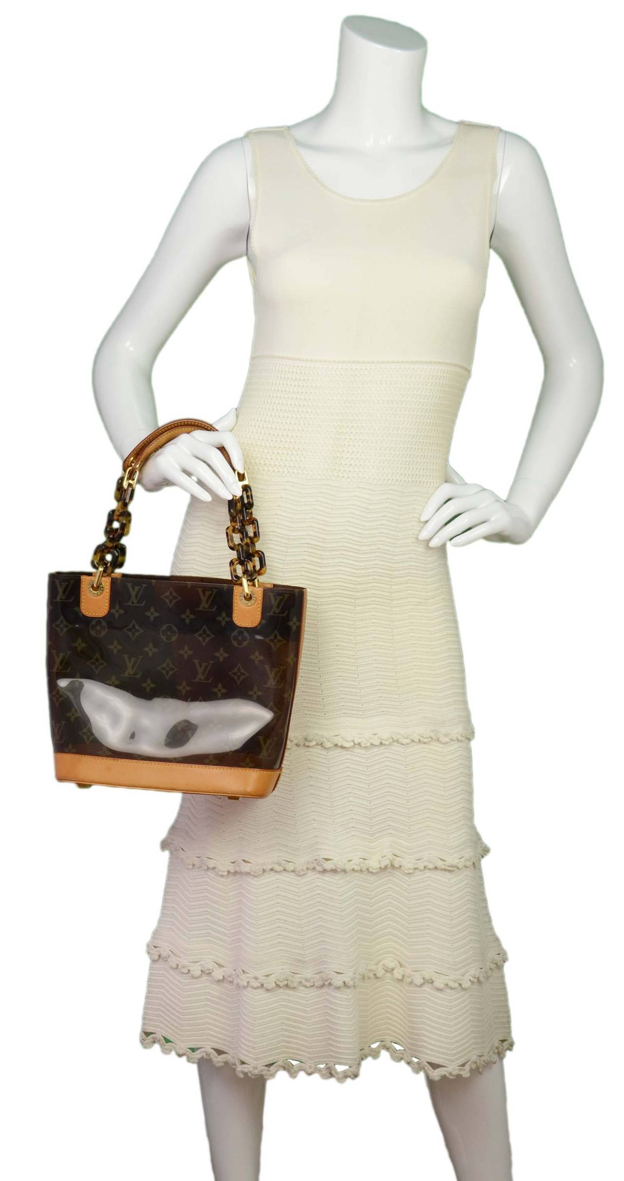 Ambre handbag Louis Vuitton Brown in Plastic - 33458671