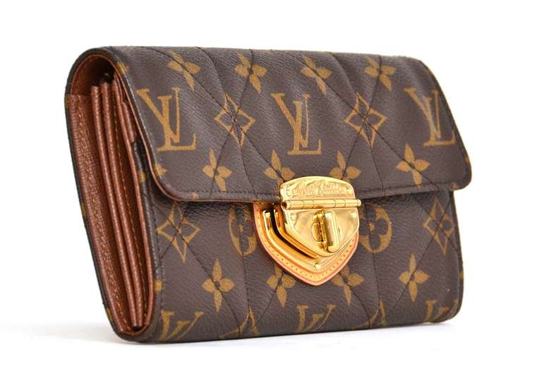 Louis Vuitton Quilted Monogram Etoile Twist Lock Wallet Rt. $1,060

    Age: c. 2008
    made in France
    Materials: coated canvas, goldtone metal
    Opens up to a coin zippered pocket, and three open pockets
    Eight card slots--six in