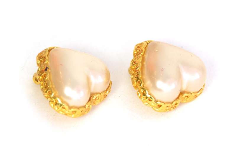 Chanel Clip On Faux Pearl Heart Earrings With CC Border

    Age: c. 1988
    Made in France
    Materials: goldtone metal, faux pearl
    Stamped 