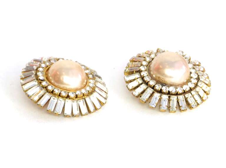 Chanel Clip On Earrings With Crystal Baquettes, Rhinestones And Faux Champagne Pearl

    Made in France
    Materials: baquettes, rhinestones, faux pearl, goldtone metal
    Stamped 