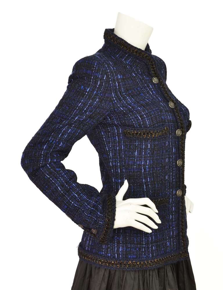 c.2010-2012
Beautiful tweed in shades of cobalt, navy, blue. and black.
Black and navy braided trim on collar, sleeves, hem, and pockets.
Five pewtertone buttons in front.
Three smaller buttons on either sleeve.
Black camelia print lining with