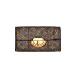 LOUIS VUITTON Quilted Monogram Etoile Twist Lock Wallet Rt. $1, 060 at  1stDibs  louis vuitton wallet with lock, louis vuitton quilted purse,  louis vuitton lock wallet
