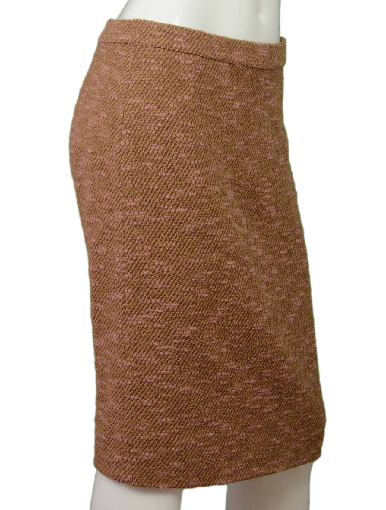 Chanel Vintage '96 Pink & Camel Boucle Skirt

    Made in: France
    Year of Production: 1996
    Color: Pink and camel
    Composition: 96% wool, 4% nylon
    Lining: Tan, 95% silk, 5% spandex
    Closure/opening: Back center zipper and