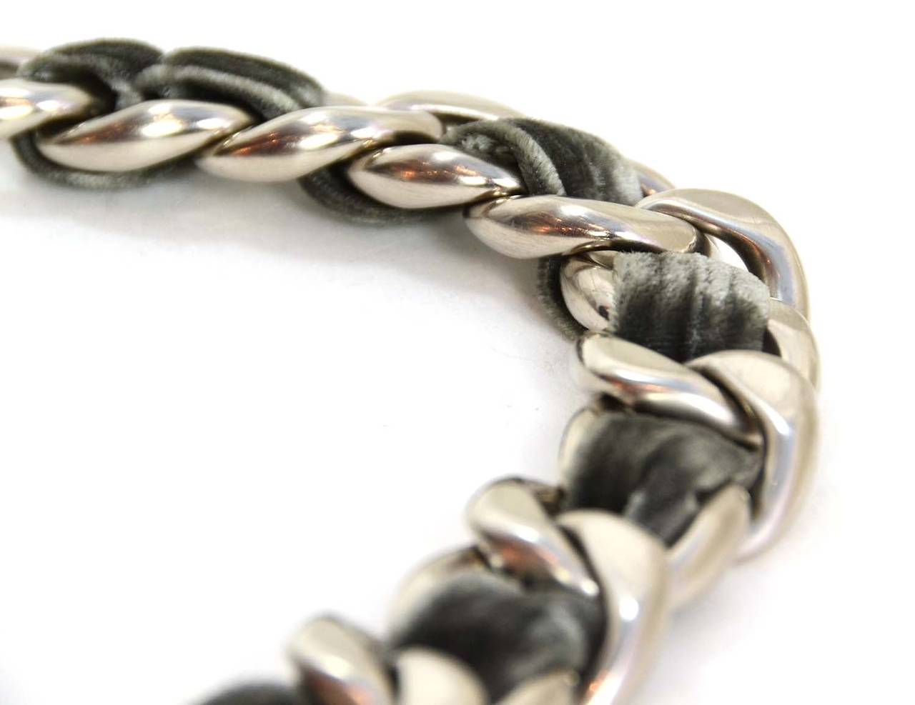 Chanel Grey Velvet Woven Silver Oversized Chain Link Necklace
Features large silver CC at back neck closure

    Made in: Italy
    Year of Production: 2013
    Stamp: B13 CC B
    Closure: Lobster claw clasp
    Color: Grey and silver
   