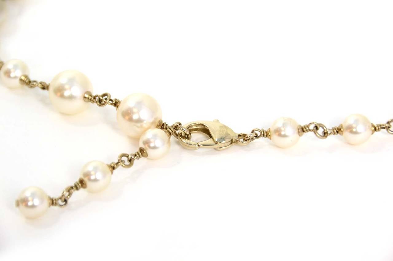 Chanel Pearl & CC Pendant Long Necklace

    Made in: France
    Year of Production: 2014
    Stamp: A14 CC V
    Closure: Lobster claw clasp
    Color: Ivory and silvertone
    Materials: Faux pearls and metal
    Overall Condition: