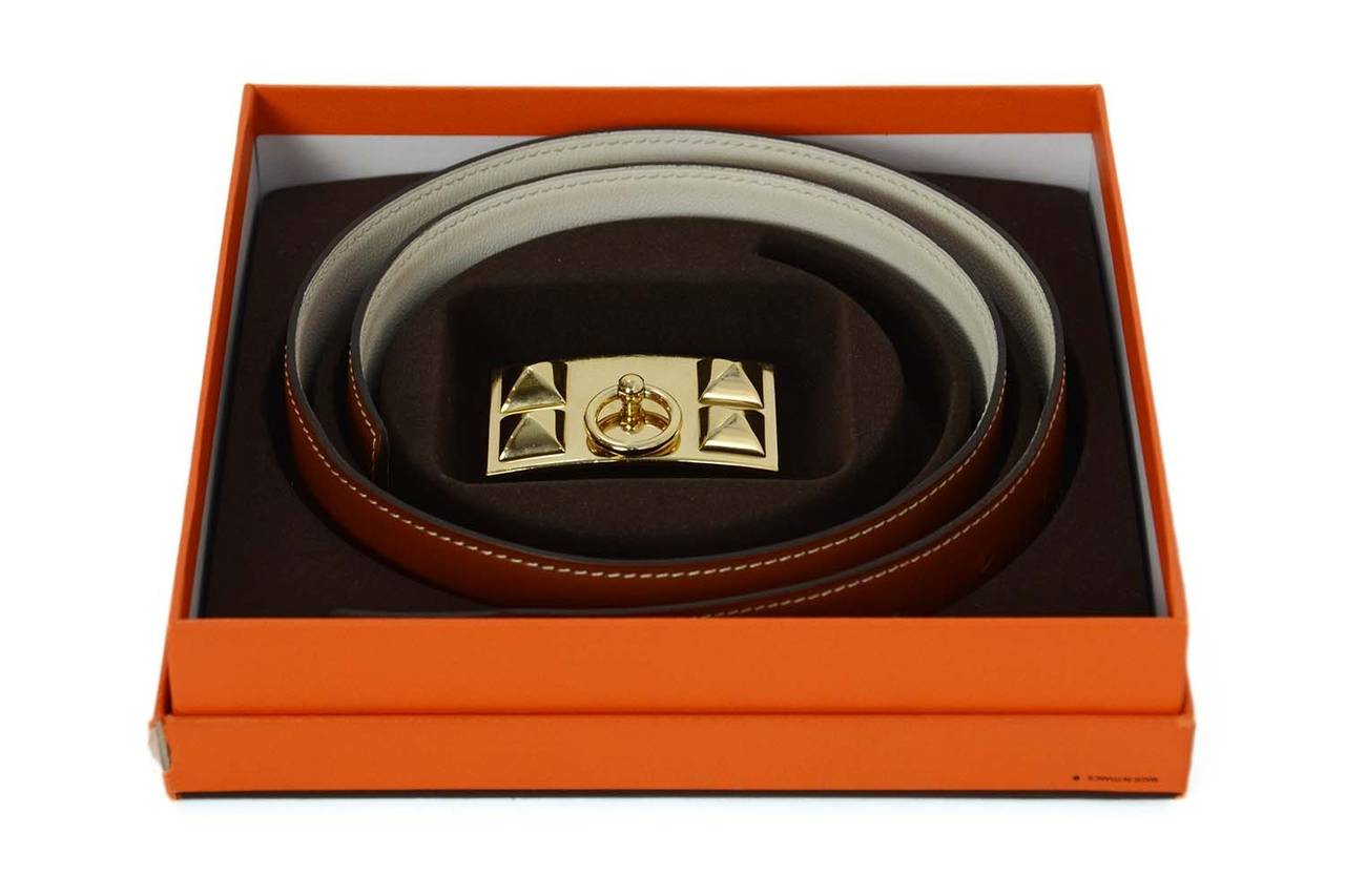 Hermes Tan & White Reversible Collier de Chien CDC Belt Kit
Tan side features white contrast stitching
Made in: France
Year of Production: 2009
Color: Tan, white and gold
Hardware: Goldtone
Materials: Leather and metal
Serial Number/Date