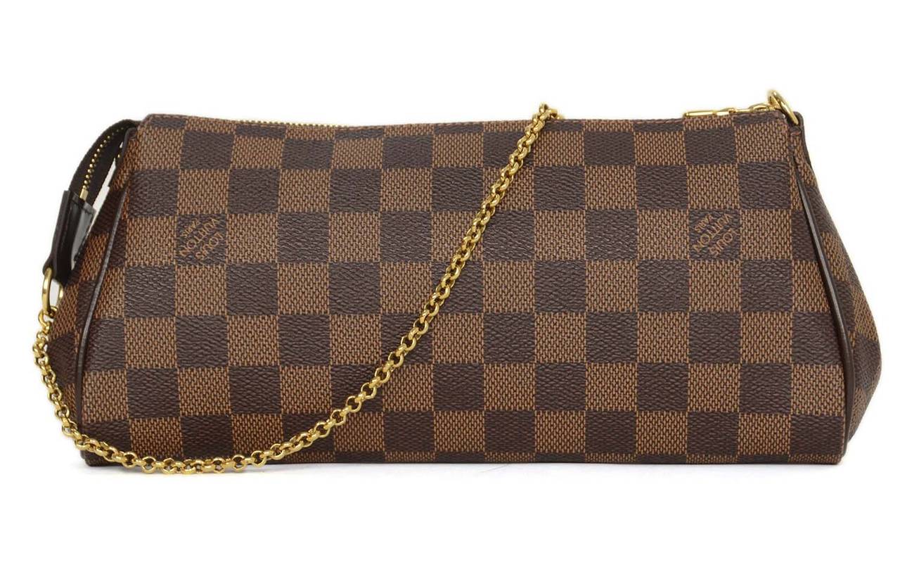 Louis Vuitton Damier Eva Clutch
Features long leather shoulder strap and smaller goldtone chain link strap
Made in: U.S.A
Year of Production: 2012
Color: Brown and goldtone
Hardware: Goldtone
Materials: Coated canvas, leather and