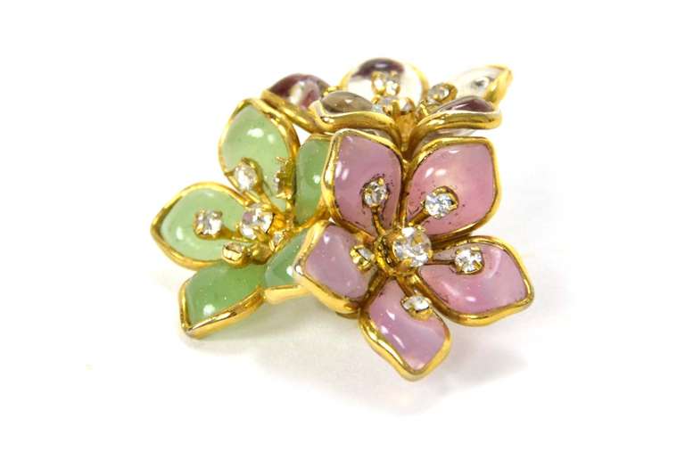 Chanel Gripoix Flower Cluster & Rhinestones Brooch & Earrings Set

Made In: France
Year of Production: 1970's-1980's
Color: Pink, blue, green and goldtone
Materials: Metal, gripoix and rhinestones
Closure: Clip on earrings and pin back