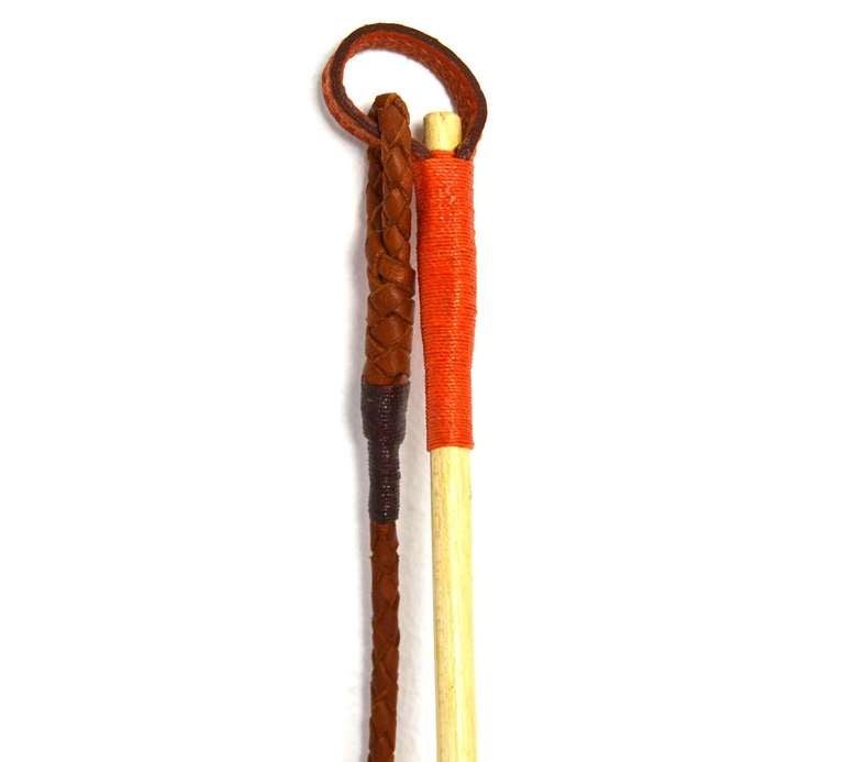 Hermes Long LUNGING WHIP W/Leather Grip

    Orange leather around grip
    Orange braided whip
    Stamped "HERMES PARIS"

Length: 58"

Excellent condition. Comes with box.