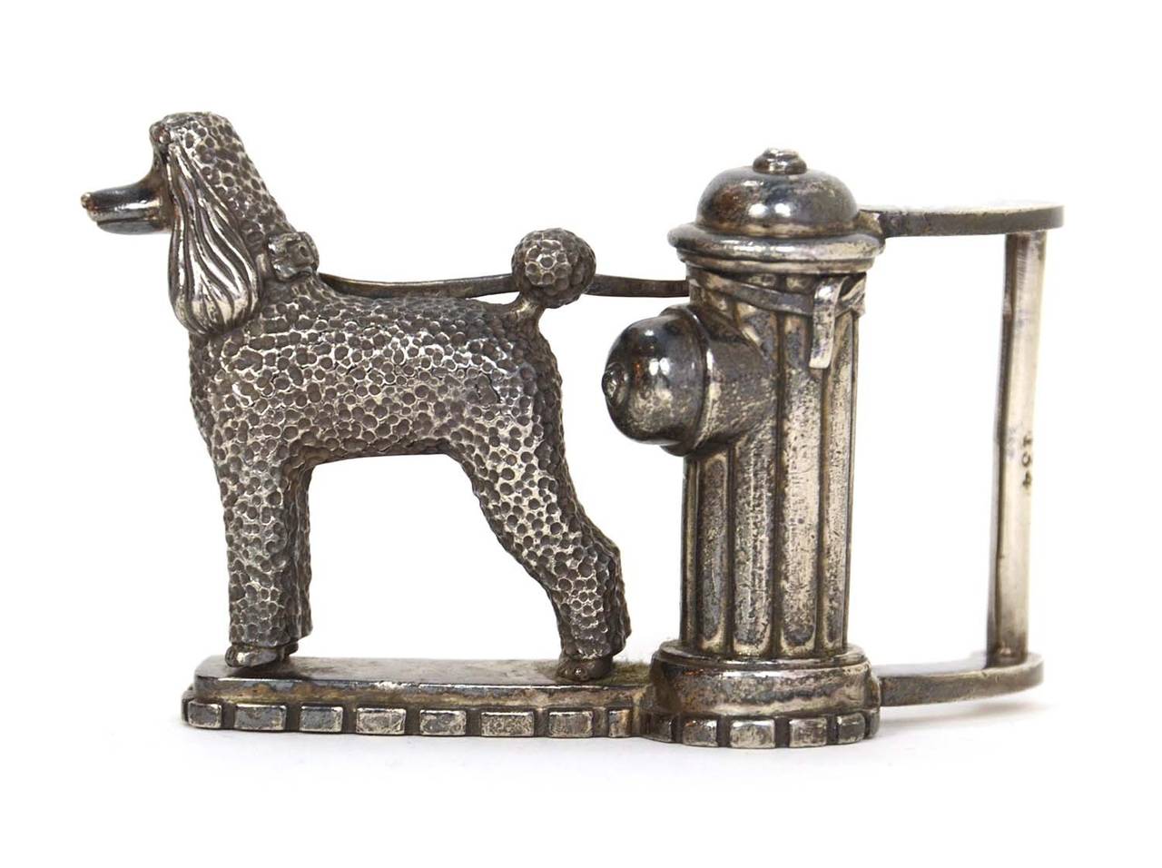 B.Kieselstein-Cord & A.Beckmann Alligator Belt w/Poodle & Hydrant Buckle
Made in: Buckle & Cord- U.S.A.
Color: Silver and black
Materials: Buckle- Sterling silver, cord- alligator skin
Serial Number/Date Stamp: B.Kieselstein-Cord 2000