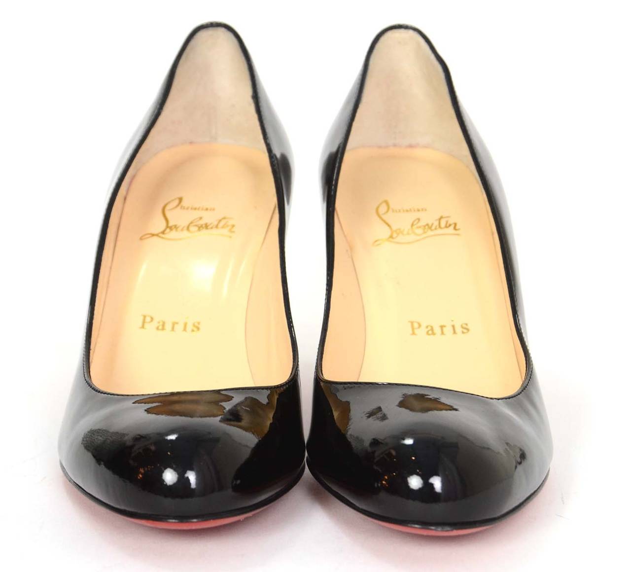 Christian Louboutin Black Patent 70mm Simple Pumps
Made in: Italy
Color: Black and red
Composition: Patent leather
Sole Stamp: Christian Louboutin Made in Italy 36 1/2
Closure/opening: Slide on
Current Retail: $675 + tax
Overall Condition: