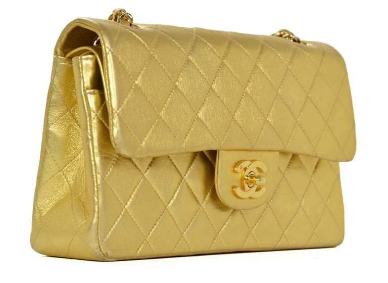 c.2002-2003
Made in France
Metallic gold leather with gold plated hardware.

This classic bag features an exterior slip pocket on the back of the bag, a zippered slip pocket on the inside of the large flap, and two slip pockets and lipstick