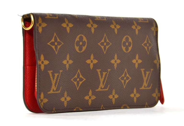 Louis Vuitton Monogram Long Insolite Wallet W/Red Lining

    Age: c.2008
    Made in Spain
    Materials: coated canvas, goldtone metal
    Wallet features a red lining with 12 card slots, 2 open pockets and one zippered pocket
    Snap